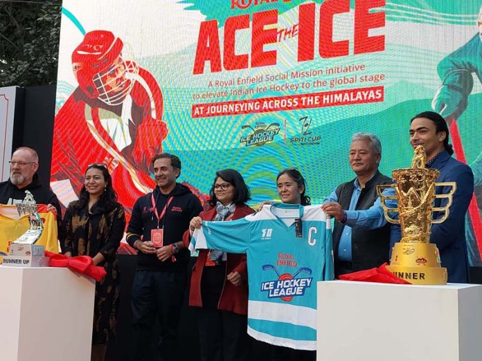 Dignitaries unveiling trophy and jersey of Ice Hockey League.