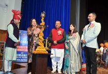 Chander Prakash Ganga, MLA from Vijaypur along with others lighting traditional lamp during Annual Day event of Humanity Public School.