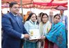 DC Kishtwar Rajesh Kumar Shawan and MLA Shagun Parihar presenting memento and shawl to para archer Sheetal Devi.