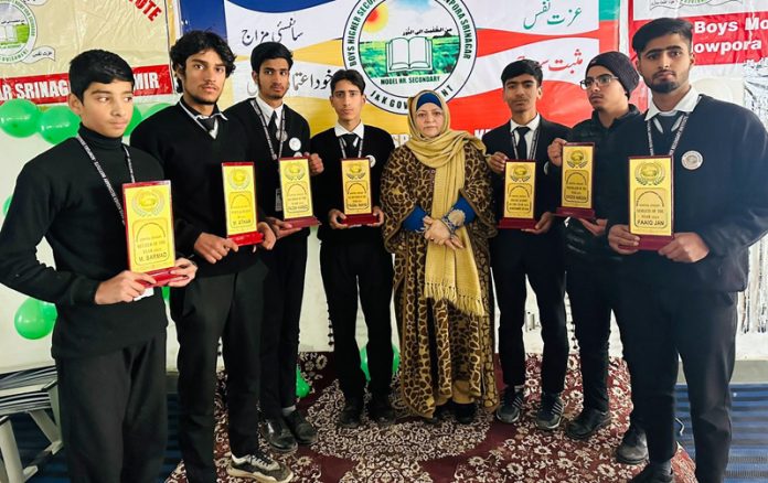 Students posing along with Principal Dr. Masrat Parveen during Annual Day event at Khanyar in Srinagar.