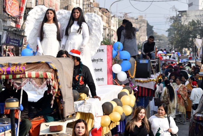 Tableaus with Santa Claus and angels during Christmas procession at Jammu city on Friday. -Excelsior/Rakesh