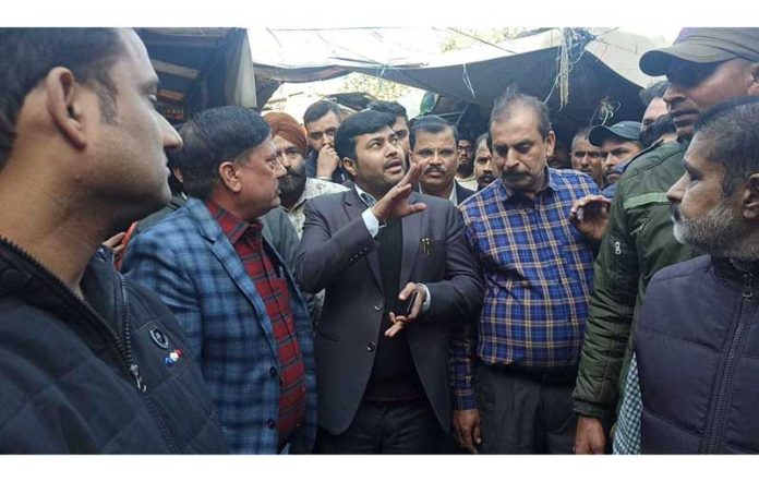 JMC Commissioner, Dr Devansh Yadav taking stock of facilities for vendors and customers during his visit to Sabzi Mandi in Prade, Jammu.