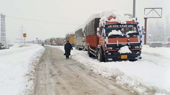 Trucks stranded on Jammu-Srinagar National Highway at Qazigund. -Excelsior/Sajad Dar