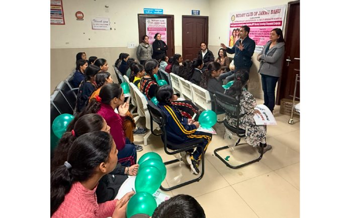 A speaker addresses girls in Jammu during a campaign to protect underprivileged girls from HPV.