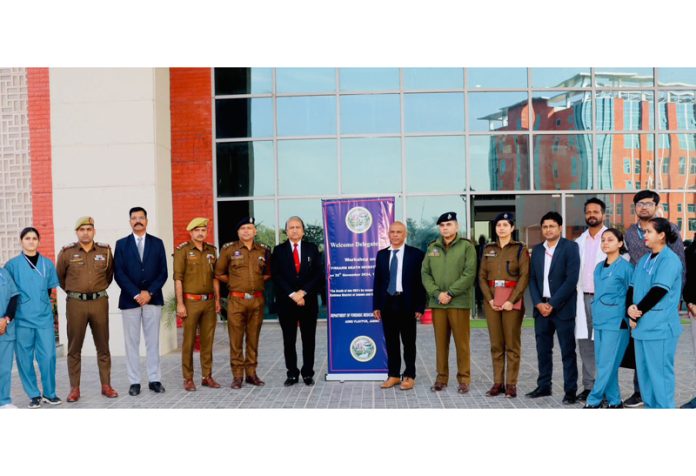 Police officers and forensic team of AIIMS Jammu posing together during a workshop in the Institute on Saturday.