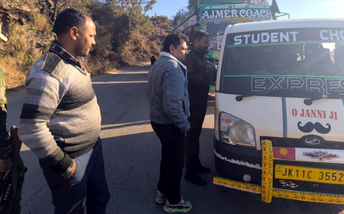 Team led by ARTO Rajouri Pawan Sharma during checking of traffic violations at Sunderbani in Rajouri on Saturday.