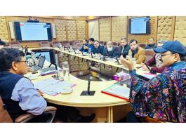 Minister Javed Ahmad Rana chairing a meeting.