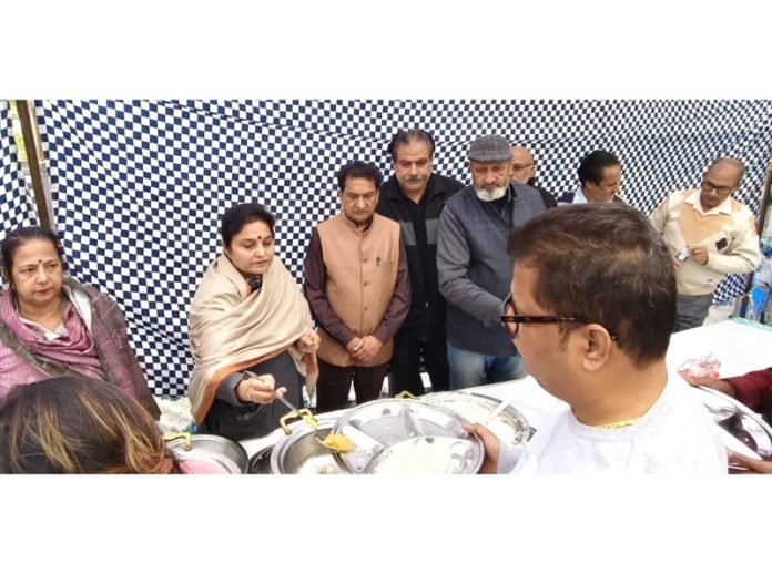 BJP leader & former Minister Priya Sethi serving a langar at a religious congregation at Sarwal on Sunday.