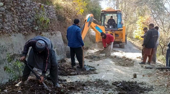 Locals of a Poonch village busy in constructing a vital road on their own.