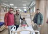 A team of doctors posing with a young patient on whom they performed a groundbreaking surgery at AIIMS Jammu.