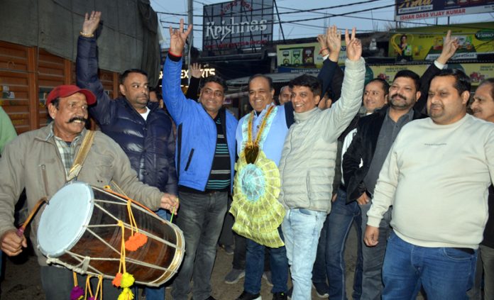 Deepak Gupta celebrating with his supporters after being elected as president of Traders Federation, Ware House, Nehru Market, Jammu.