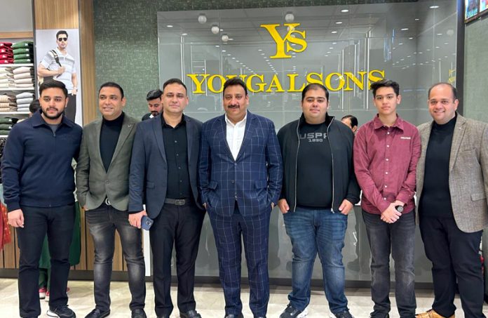 Directors of 'Yougal Sons' posing for a group photograph on opening of new showroom in Janipur on Wednesday.