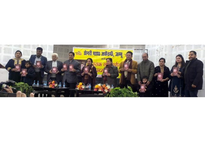 Dignitaries releasing a Dogri book during a function organised in Jammu on Monday.