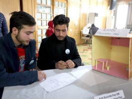 Two young students from South Kashmir’s Kulgam with their innovation “Suicide Prevention Fan’ —Excelsior/Shakeel