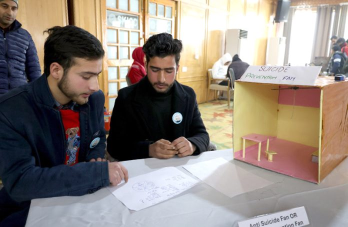 Two young students from South Kashmir’s Kulgam with their innovation “Suicide Prevention Fan’ —Excelsior/Shakeel