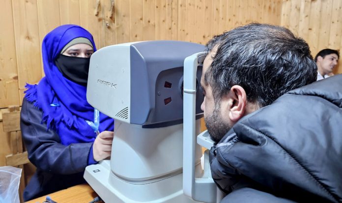 Patient being screened at a medical camp by Agarwal’s Eye Hospital at the Daily Excelsior office in Srinagar on Thursday. - Excelsior/Shakeel