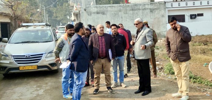 MLA Sham Lal Sharma along with officials of various departments inspecting a road in Purkhoo area of Jammu North constituency.