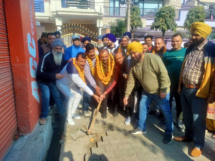 MLA Bahu, Ch Vikram Randhawa kick starting construction of lane and drain in Sanjay Nagar on Saturday.