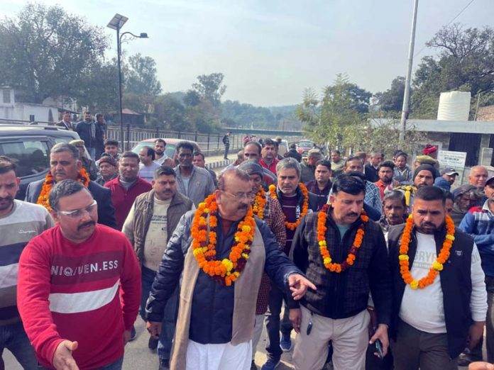 MLA Chander Parkash Ganga kick starting construction work of a road in Purmandal on Sunday.