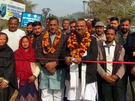 MLA Vijaypur, Chander Parkash Ganga kick starting construction of lane and drain in Purmandal on Sunday.