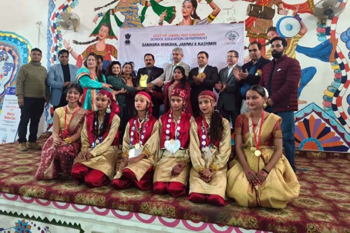 Rakesh Magotra, Project Director Samagra Shiksha posing along with the students during a function organised in Jammu on Wednesday.