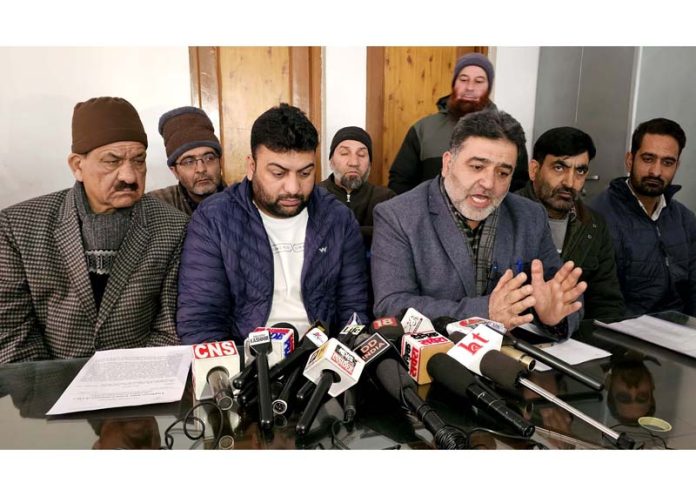 EJAC president, Wajahat Hussain along with other members during a press conference in Srinagar. -Excelsior/Shakeel