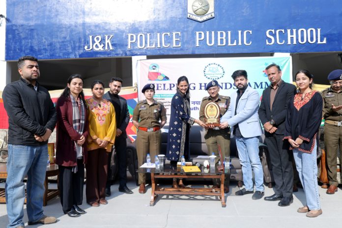 ADGP Anand Jain posing along with others during a function organised in Jammu on Tuesday.