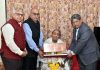 Dr Madhav Kaushik (president, Sahitya Akademi) along with other members presenting Sahitya Akademi’s Fellowship to Ved Rahi.