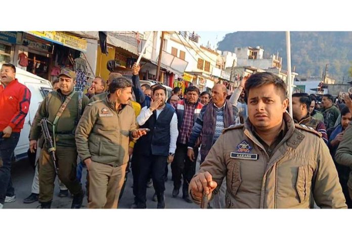 MLA Kalakote, Th Randhir Singh and his supporters taking out protest march against DyCM Surinder Choudhary at tehsil headquarters on Thursday.