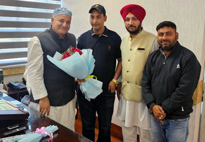 Minister Javid Dar meeting with a delegation at Jammu on Monday.