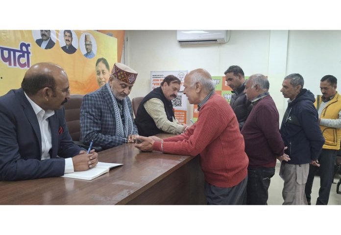 BJP MLAs listening people's grievances in a public darbar at party Headquarters at Trikuta Nagar on Monday.