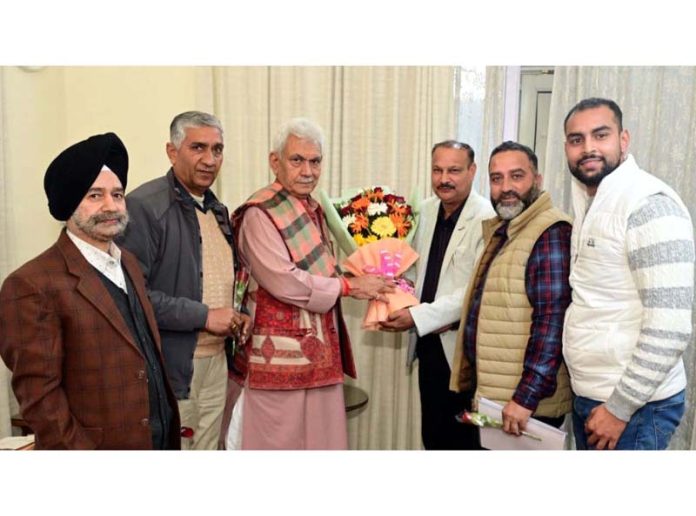 Members of Vyapar Mandal during their meeting with LG Manoj Sinha in Jammu on Monday.