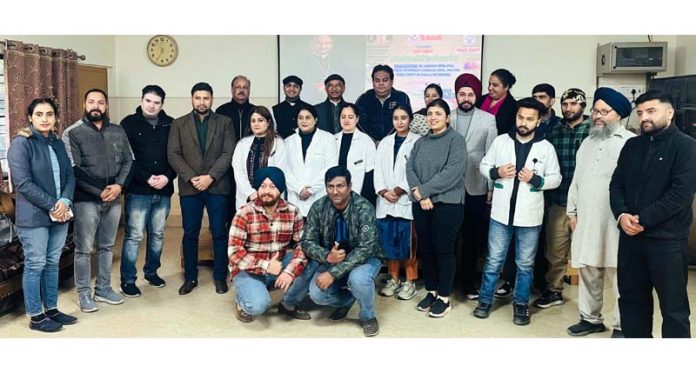 Doctors posing with organizers during a health checkup camp at St Mary's Garrison Church, Gandhinagar, Jammu.