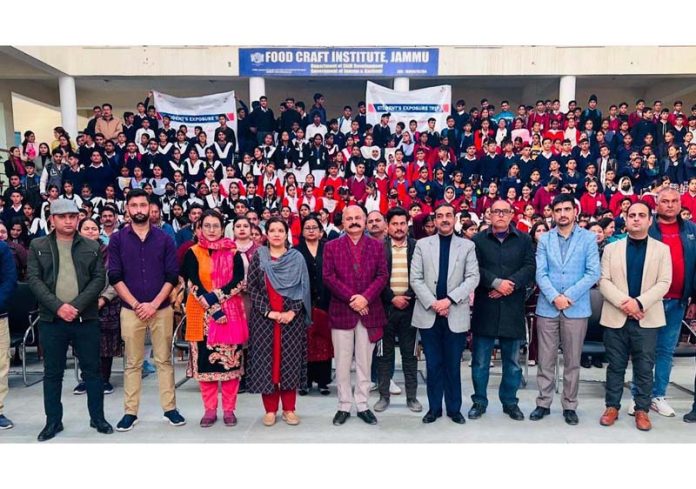 MLA Yudhvir Sethi posing along with the students during a function in Jammu on Wednesday.