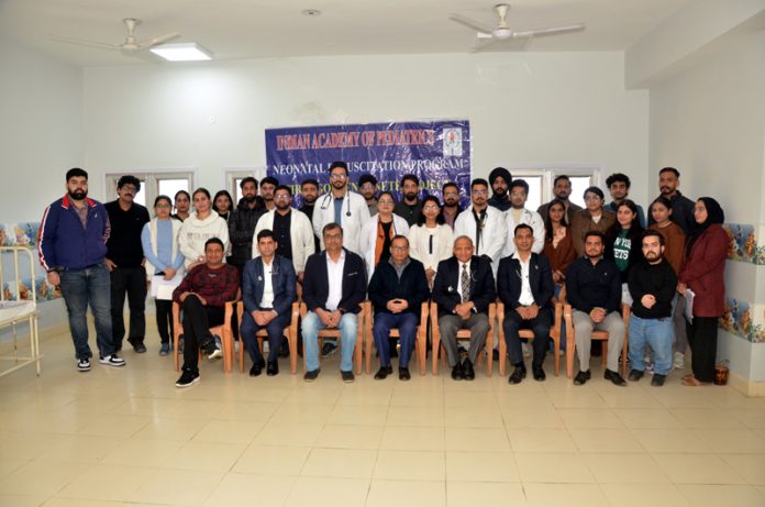 Doctors and nursing staff posing with guests during Neonatal Resuscitation Programme at ASCOMS Jammu.