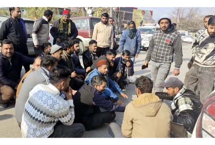 Protesting load carrier drivers blocking Mendhar-Poonch Road on Wednesday.