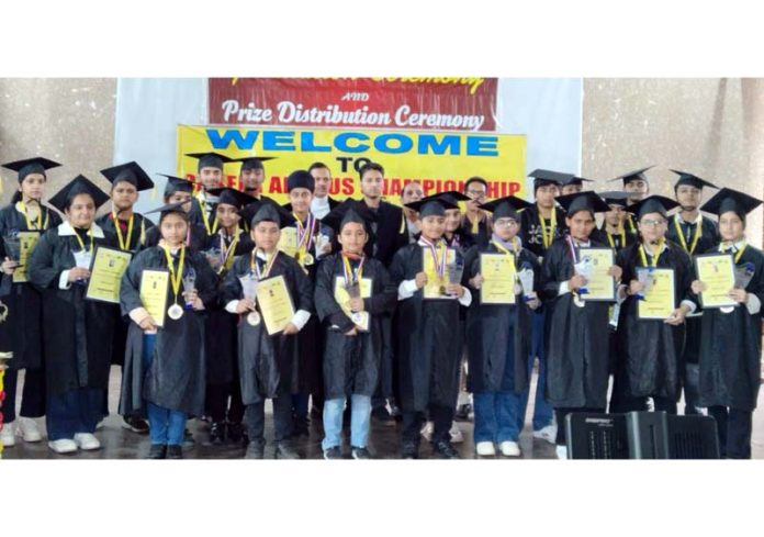 Students of Career Abacus Institute posing along with certificates during a programme.