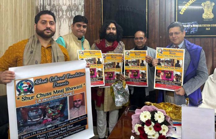 Relief Commissioner J&K, Dr Arvind Karwani, releasing Kanwal Peshin's Bhajans in Jammu on Monday.