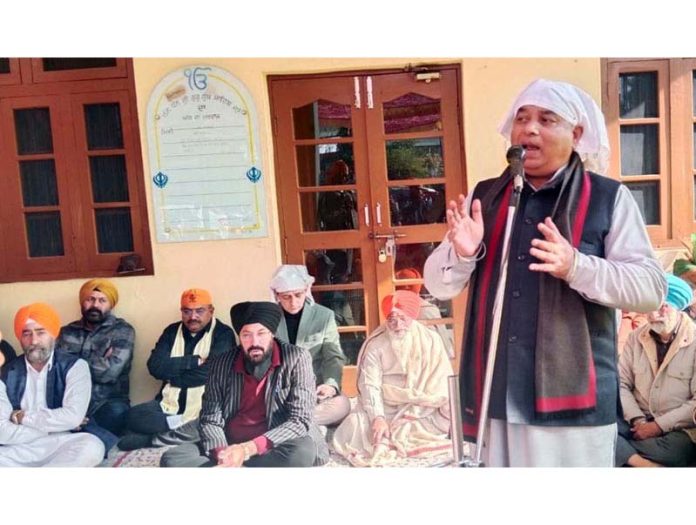 J&K BJP president Sat Sharma speaking during a religious 'samagam' organized in Jammu by party's Minority Morcha.