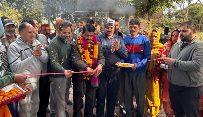 MLA Satish Sharma kick starting blacktopping work of a road in Kathua on Saturday.