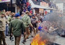 Cops keeping a strict vigil as protesters continue sloganeering in Bhaderwah on Thursday. -Excelsior/Tilak Raj