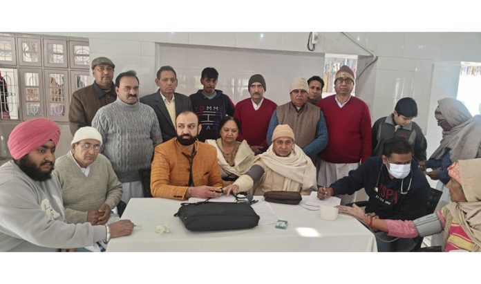 HoD Cardiology GMC & SSH Jammu Dr Sushil Sharma examining patients at R S Pura, Jammu on Sunday.