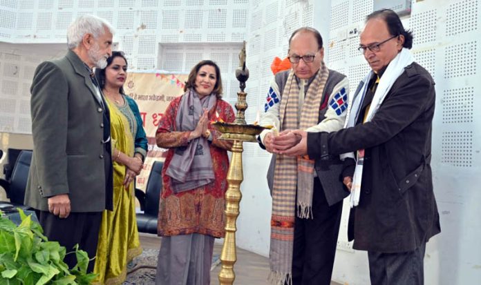 Guests lighting ceremonial lamp to inaugurate Dogri conference by JKAACL.