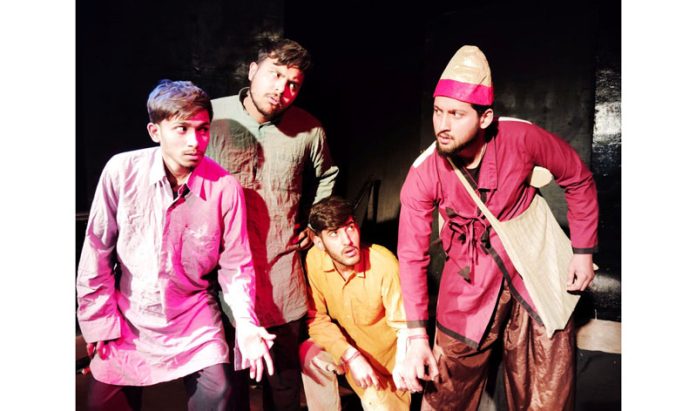 Natrang artists staging a play in Jammu on Sunday.