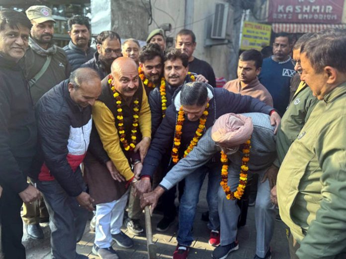 MLA Jammu East, Yudhvir Sethi kick starting laying of water supply pipes in Pahari Mohalla on Tuesday.