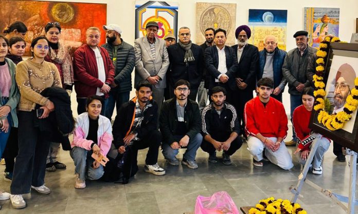 Artists and others during the culmination of an art exhibition in Jammu on Friday.