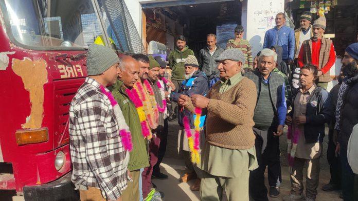 A team of firemen being accorded welcome at Latti by locals on arriving with a tender for first time in Dudu Sub Division.