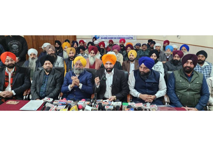 Chairman AJKSCC, Ajit Singh flanked by others addressing press conference in Jammu. — Excelsior/Rakesh