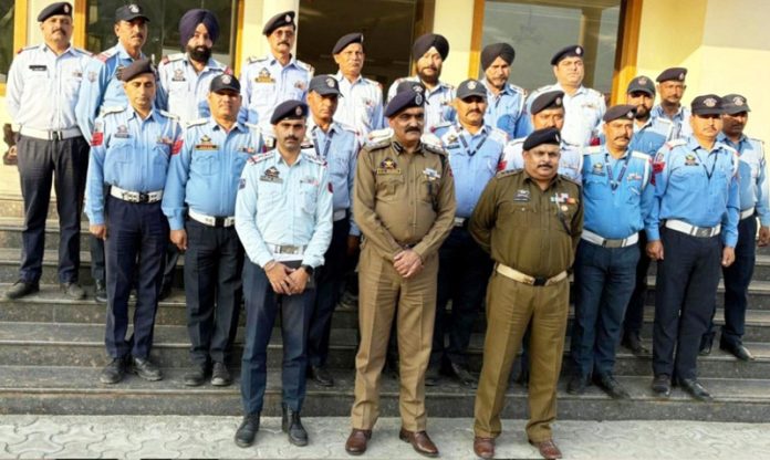 SSP Traffic Rural Jammu, Girdhari Lal Sharma along with traffic personnel posing for a photograph in Kathua on Saturday.