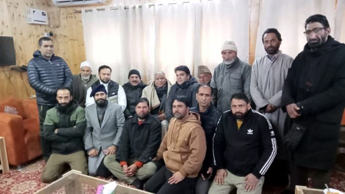 Senior RSS leader Ram Lal posing with MRM activists of Kashmir during a meeting at Srinagar on Friday.